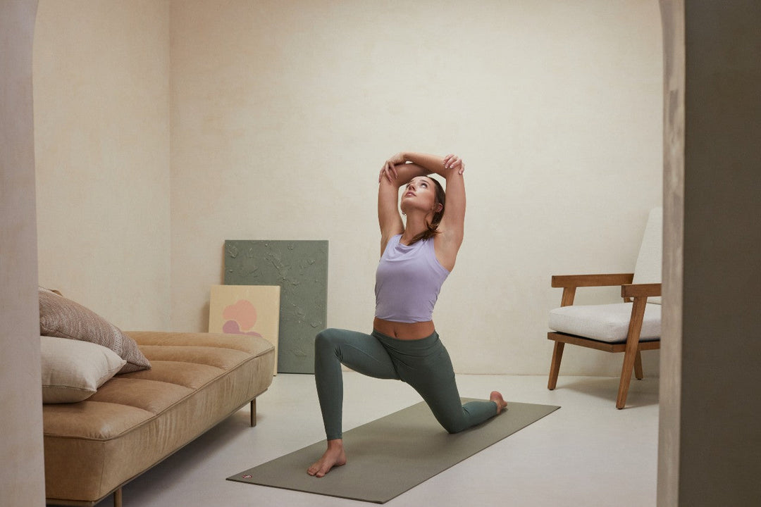 Yogi practicing an asana on a Manduka PRO 6mm yoga mat in her living room | Eco Yoga Store