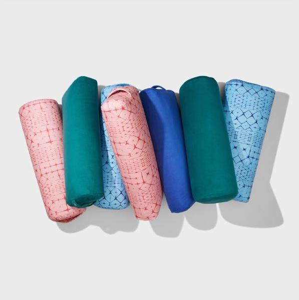 A collection of Manduka Enlight Yoga Bolsters side by side - 2021 colour series | Eco Yoga Store