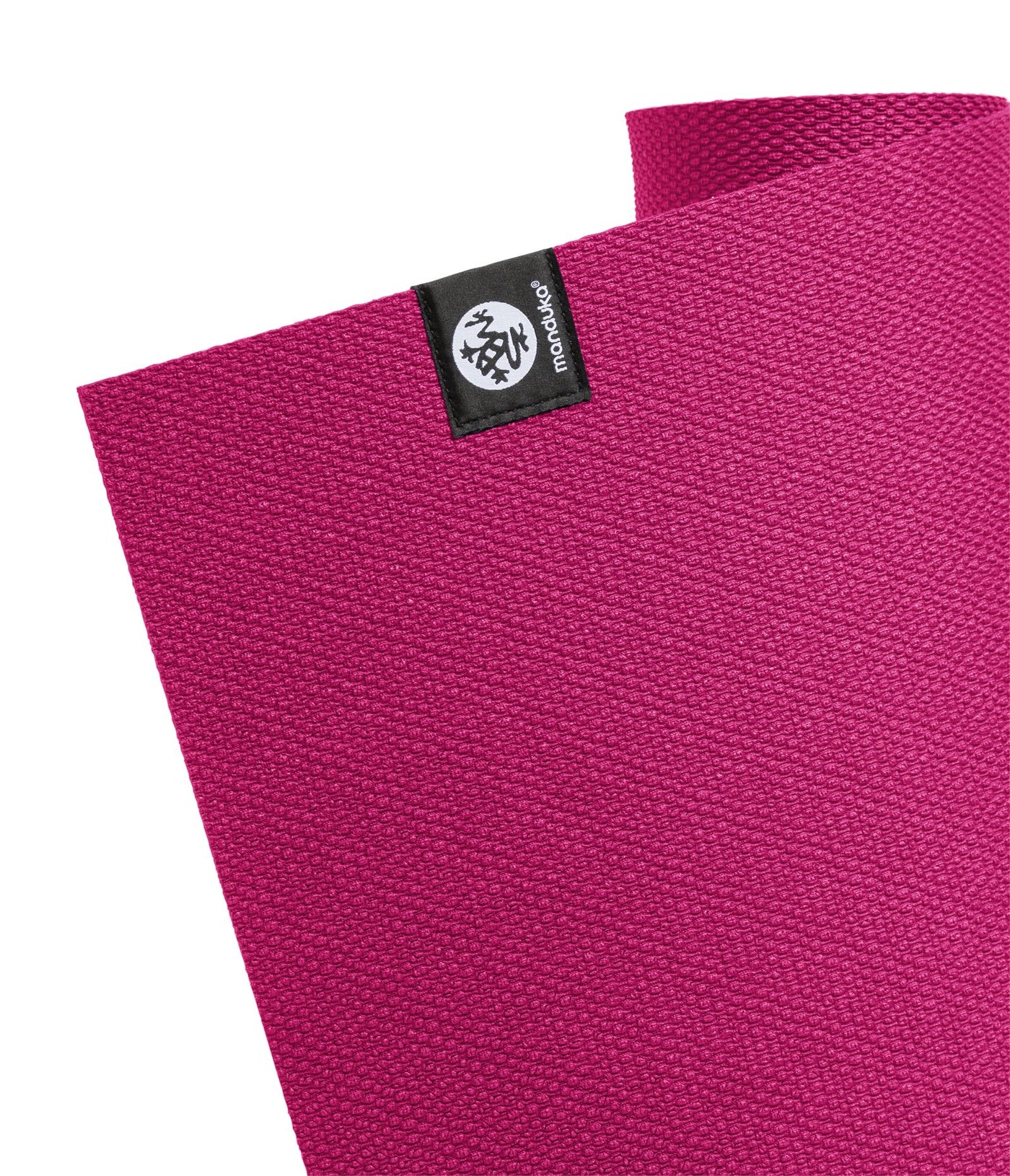 Manduka X 5mm Yoga Mat - Dark Pink - Corner of mat with logo | Eco Yoga Store