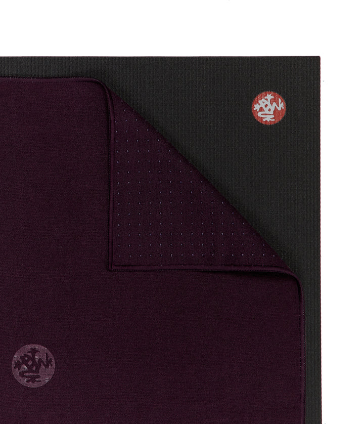 Manduka Yogitoes Hand Towel - Indulge - lying on top of a yoga mat | Eco Yoga Store