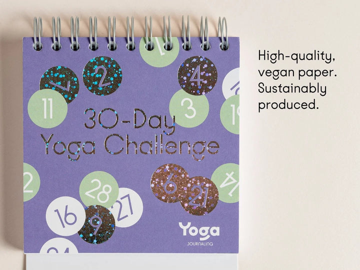 A spiral-bound '30-Day Yoga Challenge' by Yoga Journaling on a light beige background, with text on the right reading 'High-quality, vegan paper. Sustainably produced' - Yoga Journaling | Eco Yoga Store