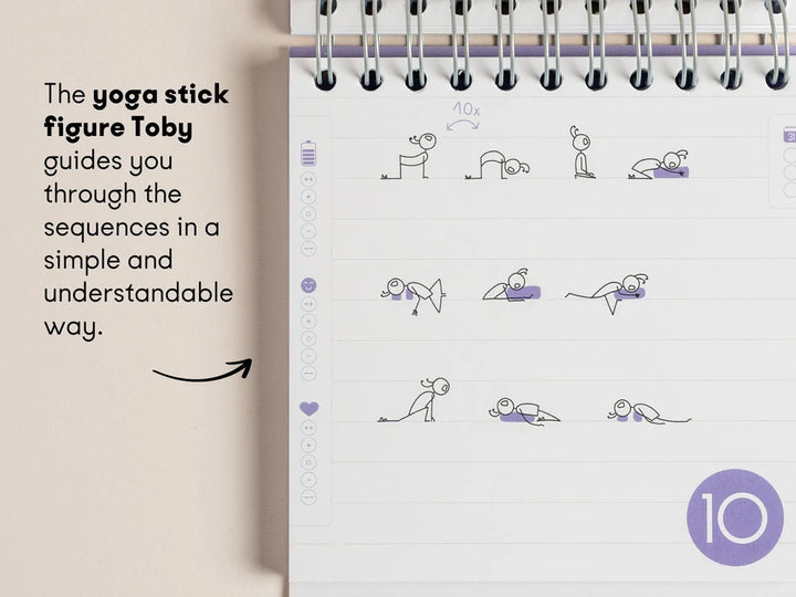 A page from the '30-Day Yoga Challenge" showing simple line drawings of figure yoga poses, with text on the left explaining that the stick figure guides you through the sequences. The page has a white background with light gray lines and small purple accents, photographed next to a beige surface - Yoga Journaling | Eco Yoga Store