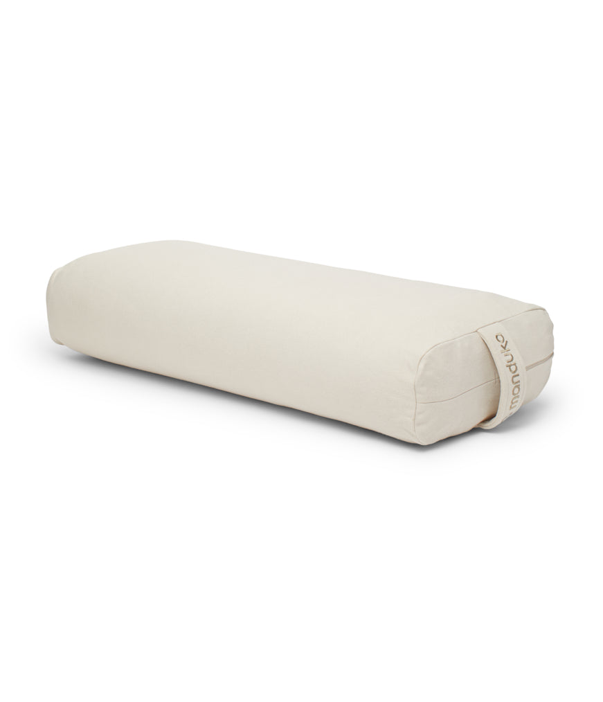 Manduka Enlight Rectangular Bolster - Sand - 45 degree angle view | Eco Yoga Store