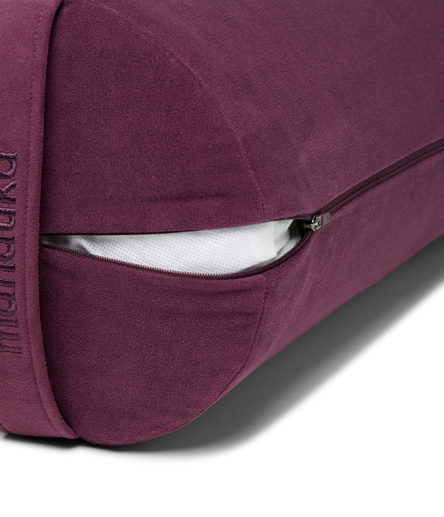 Manduka Enlight Round Bolster - Indulge - exposed filling | Eco Yoga Store