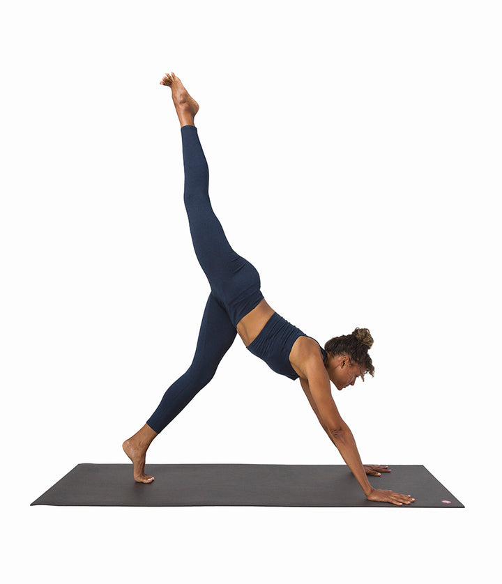 Dhara Legging - Midnight Heather - model in asana on PRO Yoga Mat - Gallery Image 6 | Manduka | Eco Yoga Store