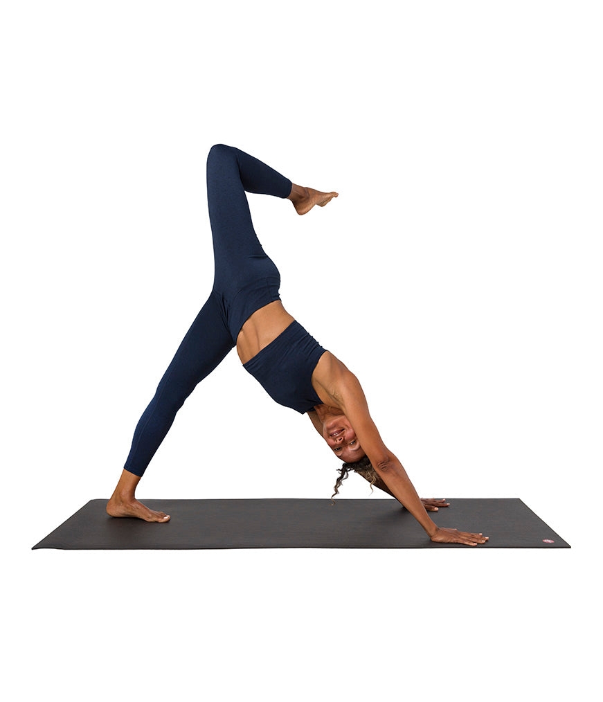 Dhara Legging - Midnight Heather - model in asana on PRO Yoga Mat - Gallery Image 7 | Manduka | Eco Yoga Store