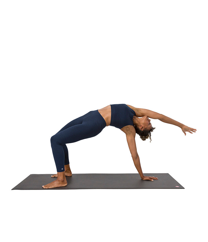 Dhara Legging - Midnight Heather - model in asana on PRO Yoga Mat - Gallery Image 8 | Manduka | Eco Yoga Store