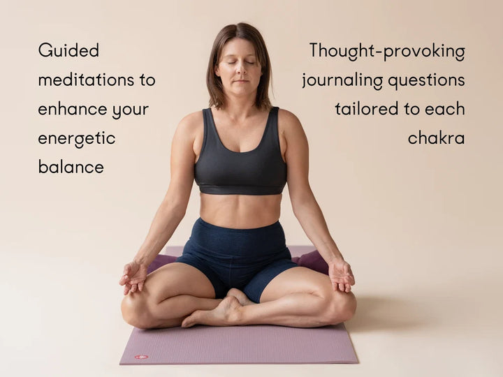 A woman meditates cross-legged on a Manduka PROLite yoga mat against a warm beige background. Text on both sides reads: 'Guided meditations to enhance your energetic balance' and 'Thought-provoking journaling questions tailored to each chakra' - Yoga Journaling | Eco Yoga Store