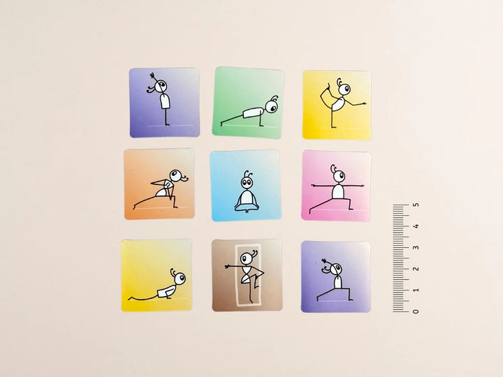 A set of nine Yoga Sequencing Magnets in a 3x3 grid on a light beige background. Each card has a different pastel gradient color (purple, green, yellow, orange, blue, pink, yellow, brown, and purple) and features a simple black line drawing of a  performing various yoga poses - Yoga Journaling | Eco Yoga Store