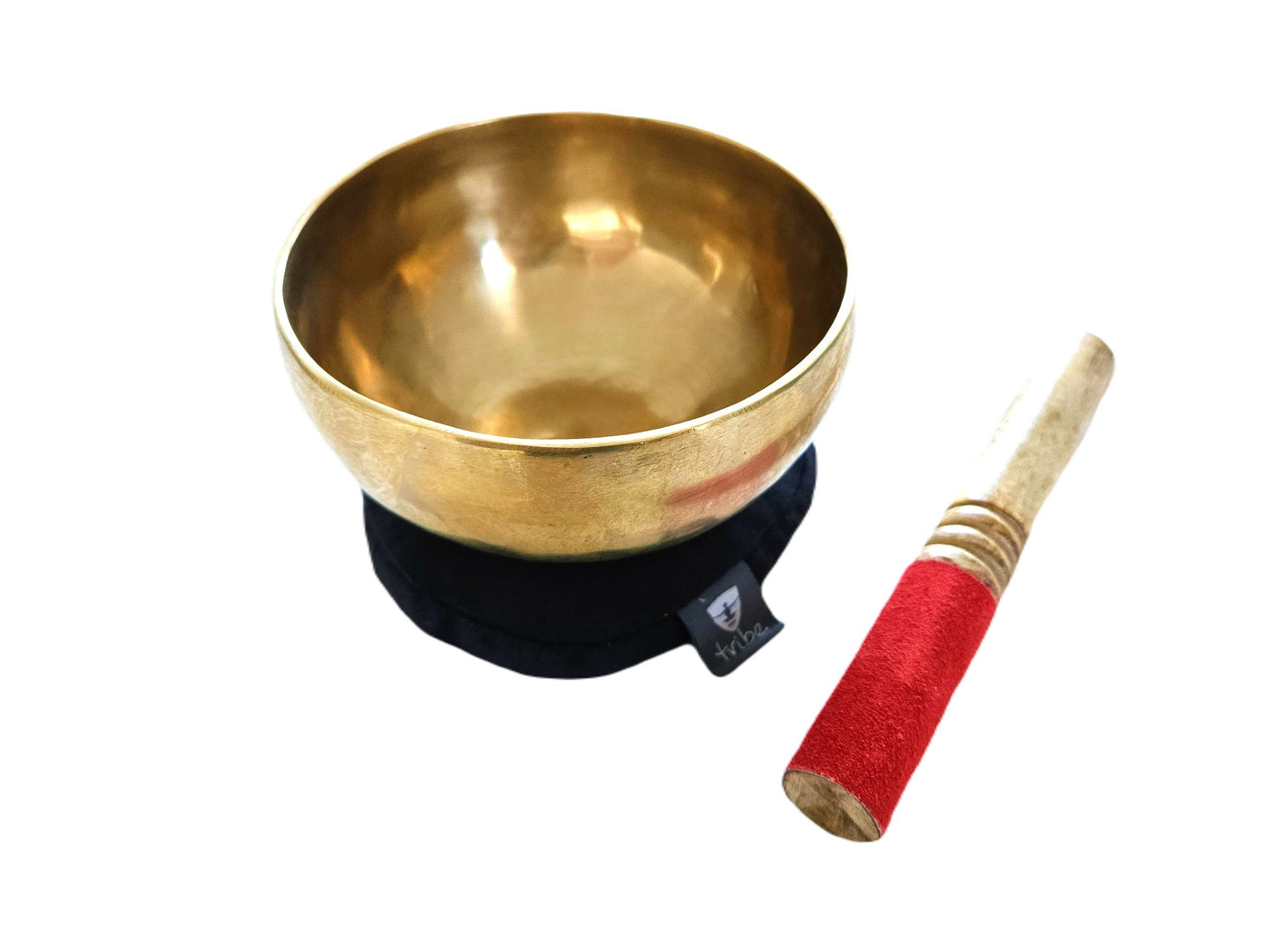Tibetan Singing Bowl - bowl sitting on cotton pad with wooden striker beside them - TRIBE | Eco Yoga Store
