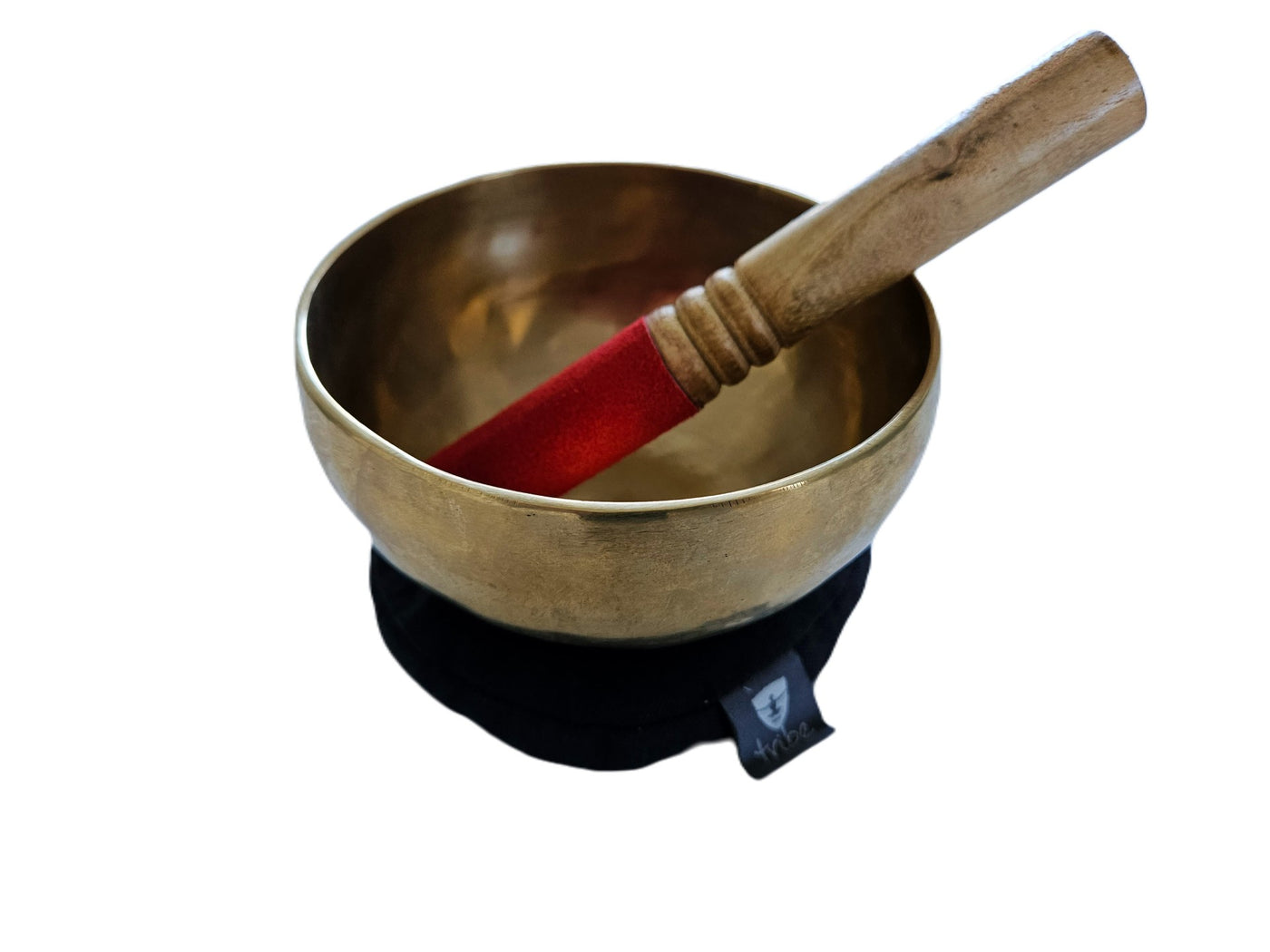 Tibetan Singing Bowl - bowl sitting on cotton pad with wooden striker inside bowl - TRIBE | Eco Yoga Store