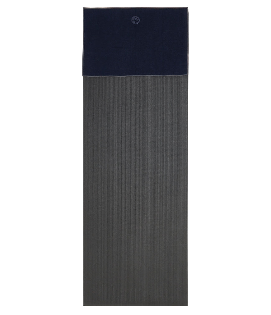 Manduka Yogitoes Hand Towel - Midnight - lying flat on top of a yoga mat | Eco Yoga Store