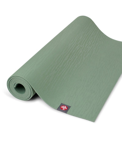 Manduka eKOLite 4mm Yoga Mat - Leaf Green - part rolled | Eco Yoga Store
