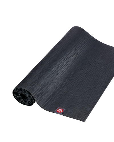 Manduka eKOLite 4mm Long Yoga Mat - Charcoal - part rolled | Eco Yoga Store