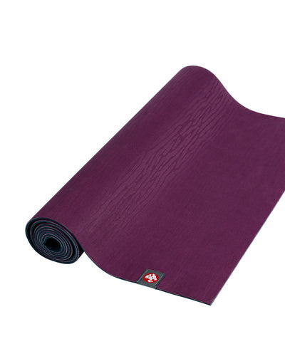 Manduka eKOLite 4mm Long Yoga Mat - Acai Midnight - part rolled | Eco Yoga Store