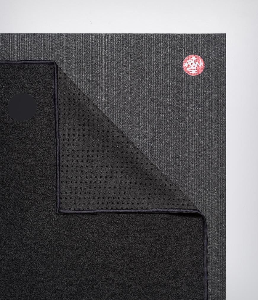 Manduka Yogitoes Mat Towel - Onyx - lying flat, corner folded over | Eco Yoga Store