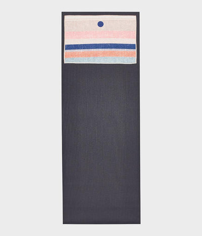 Manduka Yogitoes Hand Towel - Linen Strip - lying flat on top of a yoga mat | Eco Yoga Store