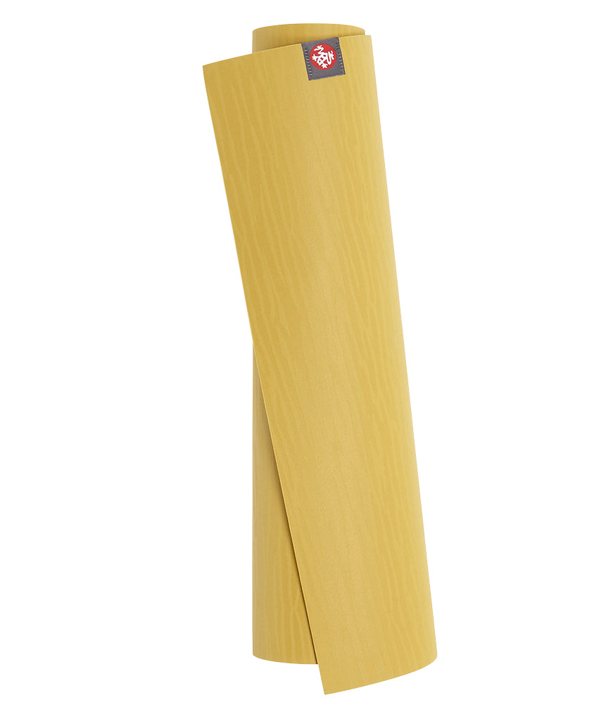 Manduka eKOLite 5mm Yoga Mat - Gold - rolled vertical | Eco Yoga Store