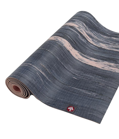 Manduka eKOLite 4mm Yoga Mat - Coral Marbled - part rolled | Eco Yoga Store