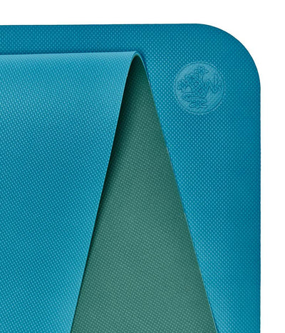 Manduka Begin Mat 5mm Yoga Mat - Bondi Blue - top corner loosely rolled showing both sides | Eco Yoga Store