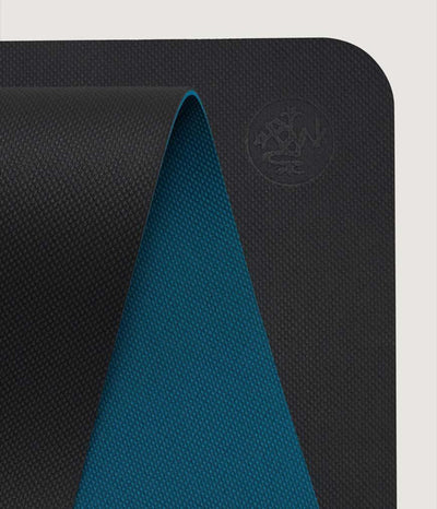 Manduka Begin Mat 5mm Yoga Mat - Steel Grey - top corner loosely rolled showing both sides | Eco Yoga Store
