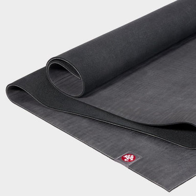 Manduka eKO 6mm Long Yoga Mat - Charcoal - part unrolled | Eco Yoga Store