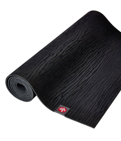 Manduka eKOLite 4mm Yoga Mat - Black - rolled flat | Eco Yoga Store