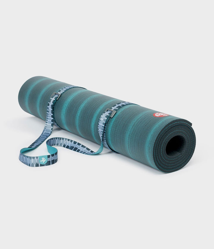 Manduka Go Move Mat Sling - Patina Squares - rolled around a yoga mat | Eco Yoga Store