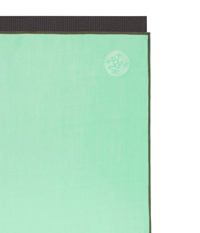 Manduka eQua Mat Towel - Green Ash - on top of a yoga mat| Eco Yoga Store