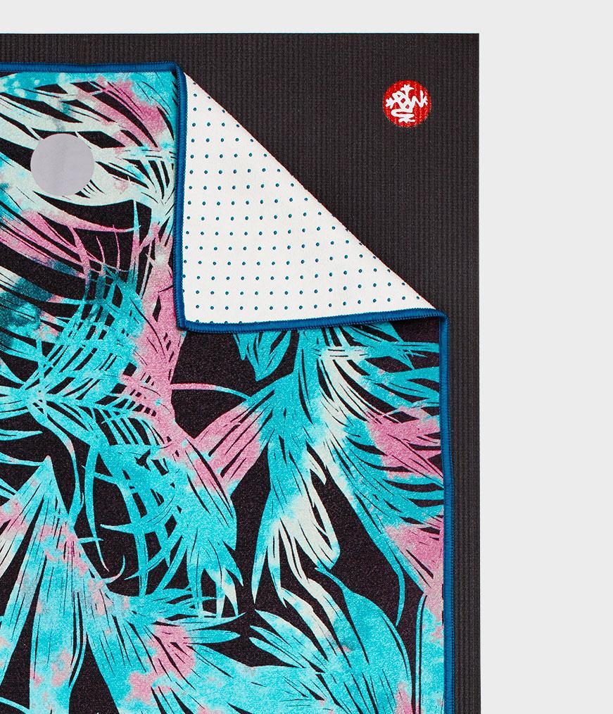 Manduka Yogitoes Mat Towel - Tropics Black - lying flat, corner folded over | Eco Yoga Store