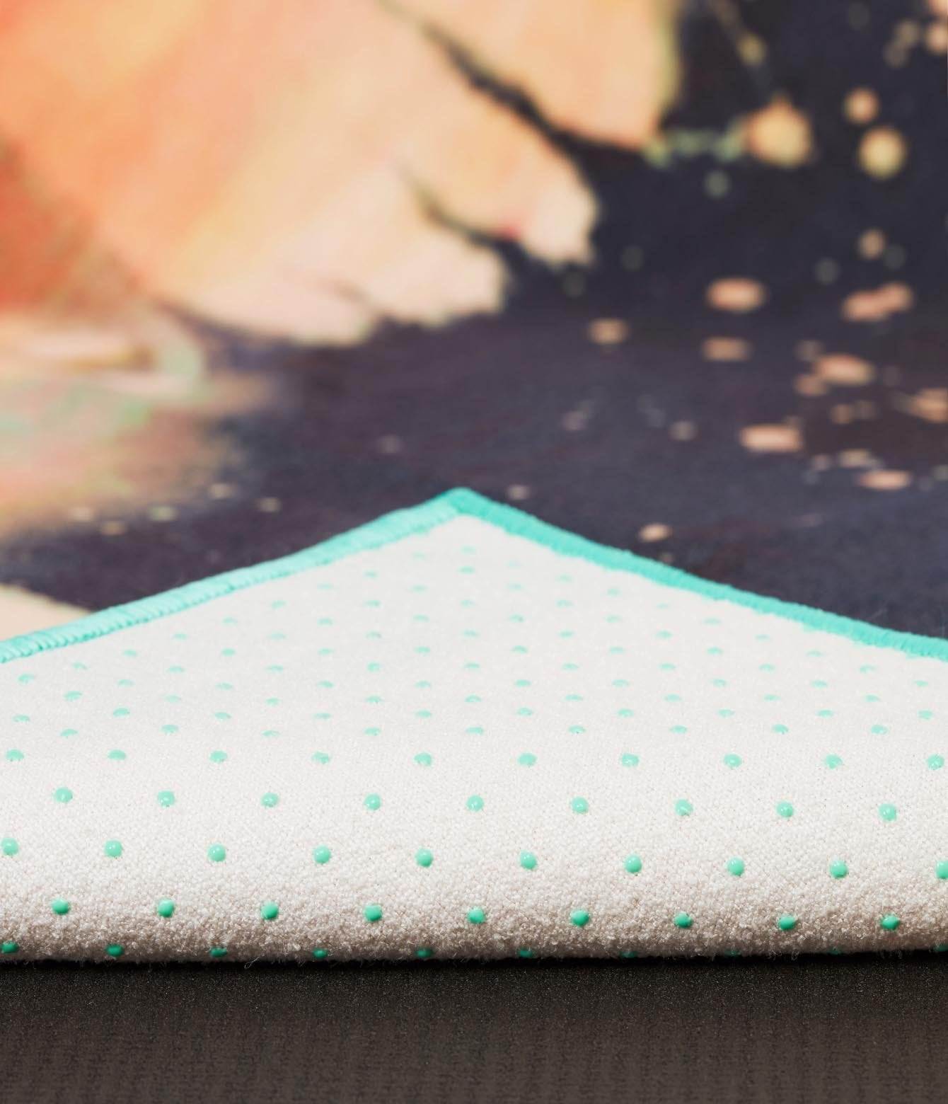 Manduka Yogitoes Mat Towel - Floral - corner folded over showing underside | Eco Yoga Store