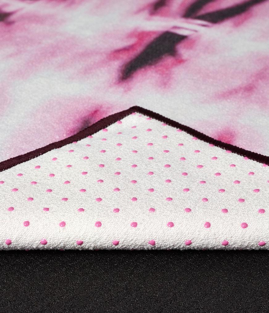 Manduka Yogitoes Mat Towel - Tie Dye Fuchsia - folded over showing underside | Eco Yoga Store