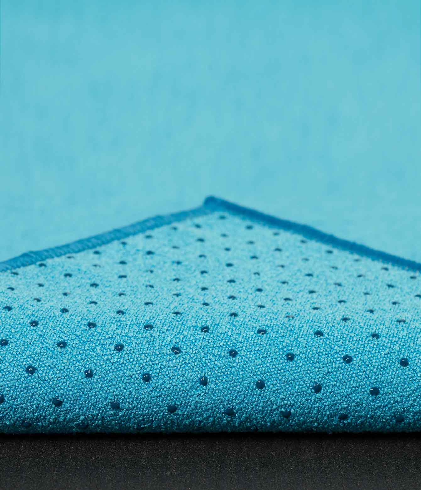 Manduka Yogitoes Mat Towel - Turquoise - corner folded over showing underside | Eco Yoga Store